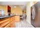 Modern kitchen showcasing the central island and stainless steel appliances at 207 Meadow Lake Dr, Carrollton, GA 30116