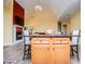 Stylish kitchen island overlooking a cozy living room with fireplace, designed for modern living at 207 Meadow Lake Dr, Carrollton, GA 30116