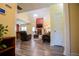 Inviting view of the Gathering room with wood-look flooring, fireplace, high ceilings and a stylish chandelier at 207 Meadow Lake Dr, Carrollton, GA 30116