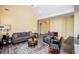 Bright living room with a vaulted ceiling, neutral paint, and comfortable seating furniture at 207 Meadow Lake Dr, Carrollton, GA 30116