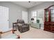 Comfortable living room with recliner, hutch, and ample windows for a relaxed atmosphere at 207 Meadow Lake Dr, Carrollton, GA 30116