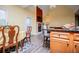 Living area featuring dining, fireplace, TV, and access to the backyard at 207 Meadow Lake Dr, Carrollton, GA 30116
