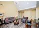 Comfortable living room with a vaulted ceiling, soft lighting, hardwood floors, and stylish furniture at 207 Meadow Lake Dr, Carrollton, GA 30116