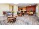 Cozy living room with open layout including an adjacent kitchen and dining area, perfect for gatherings at 207 Meadow Lake Dr, Carrollton, GA 30116