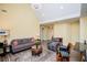 Bright living room with a vaulted ceiling, neutral paint, and a cozy seating arrangement at 207 Meadow Lake Dr, Carrollton, GA 30116