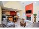Open-concept living room with a fireplace, high ceilings, and views of the kitchen and dining area at 207 Meadow Lake Dr, Carrollton, GA 30116