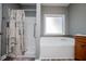 Main bathroom featuring a separate tub and shower at 207 Meadow Lake Dr, Carrollton, GA 30116