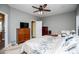 Comfortable main bedroom with ceiling fan, neutral paint, and ample natural light at 207 Meadow Lake Dr, Carrollton, GA 30116