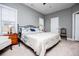 Bright main bedroom features neutral paint, ceiling fan, and two sunny windows at 207 Meadow Lake Dr, Carrollton, GA 30116