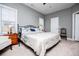 Well-lit main bedroom with a ceiling fan, and large windows at 207 Meadow Lake Dr, Carrollton, GA 30116