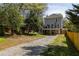 Backyard of home features deck, walk out basement, and gravel driveway at 513 Boulevard Se, Atlanta, GA 30312