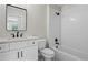 Bathroom with a white vanity, mirror and subway tile and a black shower and sink fixtures at 1698 Cunningham Sw Rd, Marietta, GA 30008