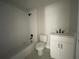 Bathroom features a white subway tile shower, granite vanity and patterned tile flooring at 1698 Cunningham Sw Rd, Marietta, GA 30008