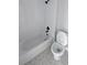 Modern bathroom with white subway tile shower and patterned floor at 1698 Cunningham Sw Rd, Marietta, GA 30008