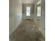 Bright entryway featuring wainscoting, a front door, and view to the front yard at 1698 Cunningham Sw Rd, Marietta, GA 30008