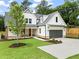 Charming new construction with a modern farmhouse design and well-manicured lawn at 1698 Cunningham Sw Rd, Marietta, GA 30008