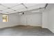 Spacious garage with painted walls and concrete floors at 1698 Cunningham Sw Rd, Marietta, GA 30008