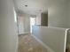 Hallway featuring white trim, baseboards, and a doorway at the end at 1698 Cunningham Sw Rd, Marietta, GA 30008