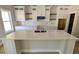 Modern kitchen featuring a large island, white cabinets and a gold faucet at 1698 Cunningham Sw Rd, Marietta, GA 30008