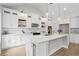 Beautiful kitchen with white cabinets, granite countertops, stainless steel appliances, and a large island at 1698 Cunningham Sw Rd, Marietta, GA 30008