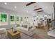 Open-concept living space featuring wood floors, exposed beams, and abundant natural light at 1698 Cunningham Sw Rd, Marietta, GA 30008