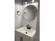 Chic powder room features a modern vanity, stylish mirror, and elegant wallpaper at 1698 Cunningham Sw Rd, Marietta, GA 30008