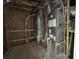 Utility equipment is shown inside the unfinished utilities room at 1698 Cunningham Sw Rd, Marietta, GA 30008