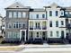Townhouse complex with brick and siding, featuring balconies and manicured lawns at 2350 Edgar Park Pl # 98, Duluth, GA 30096