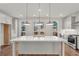 Spacious kitchen with quartz countertops, stainless appliances, and pendant lights at 2350 Edgar Park Pl # 98, Duluth, GA 30096