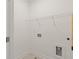 A simple, unfinished laundry room with a shelf and outlets at 2350 Edgar Park Pl # 98, Duluth, GA 30096
