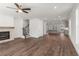 Open-concept living room boasts fireplace and views of the kitchen at 2350 Edgar Park Pl # 98, Duluth, GA 30096