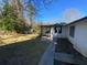 Well-maintained backyard featuring a covered patio area, and mature trees at 3531 Creighton Sw Rd, Atlanta, GA 30331