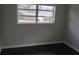 Bedroom featuring ample light from the large windows, and a calming neutral color scheme at 3531 Creighton Sw Rd, Atlanta, GA 30331
