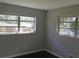 Bright bedroom featuring windows providing natural light, and a neutral color palette at 3531 Creighton Sw Rd, Atlanta, GA 30331