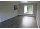 The open-concept dining area features laminate flooring, white brick accents, and access to the kitchen at 3531 Creighton Sw Rd, Atlanta, GA 30331