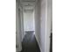 Hallway with dark wood-look floors and neutral paint at 3531 Creighton Sw Rd, Atlanta, GA 30331