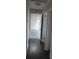 Hallway featuring hardwood floors, neutral colored walls, and multiple doorways at 3531 Creighton Sw Rd, Atlanta, GA 30331