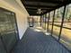 Spacious screened porch with a ceiling fan, offering a relaxing outdoor living area at 3531 Creighton Sw Rd, Atlanta, GA 30331