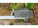 An aerial view of the backyard and the house with light gray shingle roof at 6446 E Windsor Ln, Norcross, GA 30093