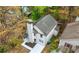 An aerial view of the backyard and the house with light gray shingle roof at 6446 E Windsor Ln, Norcross, GA 30093