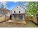 Back exterior view showcasing the new wooden deck and fenced backyard at 6446 E Windsor Ln, Norcross, GA 30093