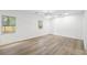 Spacious bedroom features luxury vinyl plank flooring and lots of natural light at 6446 E Windsor Ln, Norcross, GA 30093
