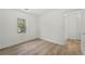 Neat bedroom features a closet and hardwood floors, bathed in light from the window at 6446 E Windsor Ln, Norcross, GA 30093
