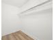 Walk-in closet featuring luxury vinyl plank flooring and closet shelving at 6446 E Windsor Ln, Norcross, GA 30093