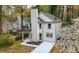 Rear exterior showcasing a well-maintained home with a covered porch and backyard at 6446 E Windsor Ln, Norcross, GA 30093