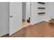 Basement featuring hardwood flooring, a doorway and modern decor at 1506 Knights Trl, Stone Mountain, GA 30083