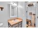 Modern bathroom with vanity, decorative mirror, and spacious closet at 1506 Knights Trl, Stone Mountain, GA 30083
