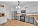 Bright kitchen with stainless steel refrigerator and black appliances at 1506 Knights Trl, Stone Mountain, GA 30083