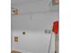 Uncluttered laundry room with white walls, shelving and laminate flooring at 1506 Knights Trl, Stone Mountain, GA 30083