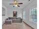 Bright living room featuring a comfortable couch and ample natural light from the nearby windows at 1506 Knights Trl, Stone Mountain, GA 30083